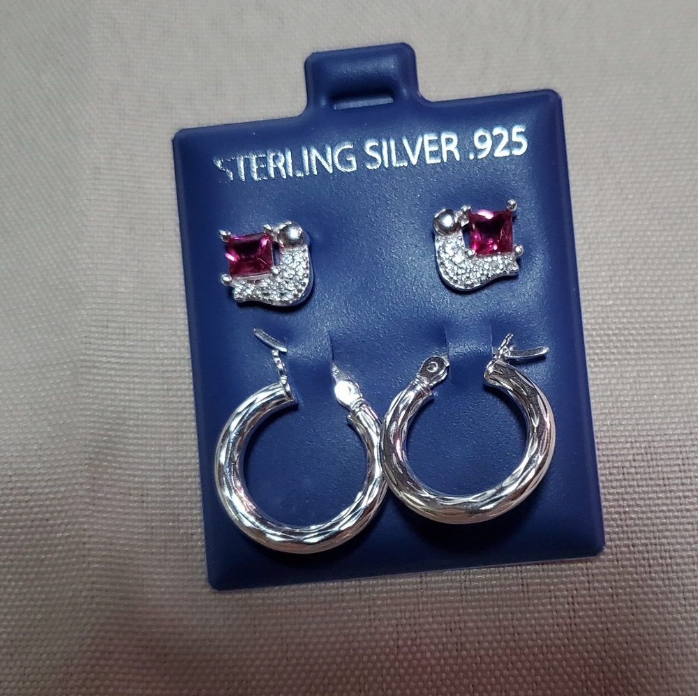 Sterling silver small hoops and post earings with ruby princess cut stone.